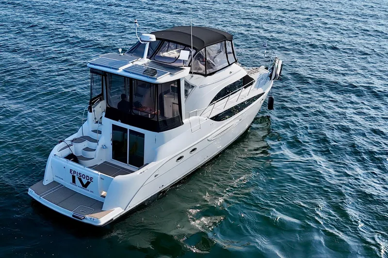  Yacht Photos Pics 2005 Meridian 459 CMY yacht cruising on open water.