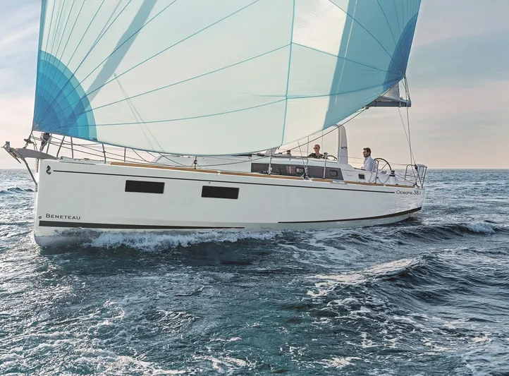 Wanderlust Yacht Photos Pics 2019 Beneteau Oceanis 38.1 sailing on open sea with blue spinnaker.