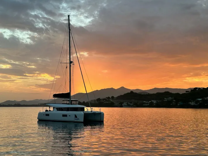 Always Sunday Yacht Photos Pics Lagoon 42 catamaran at sunset on calm waters, 2020 model.