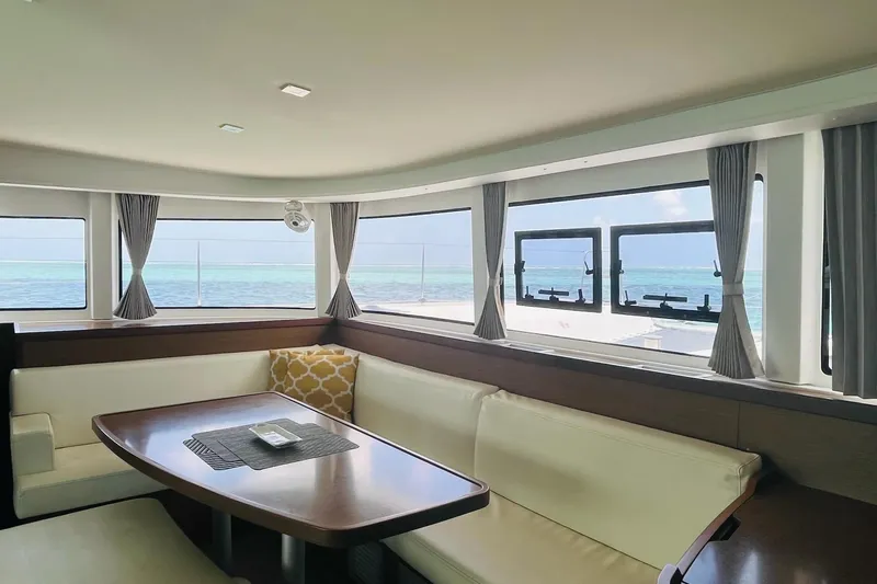 Always Sunday Yacht Photos Pics Interior of 2020 Lagoon 42 catamaran with ocean view through large windows.