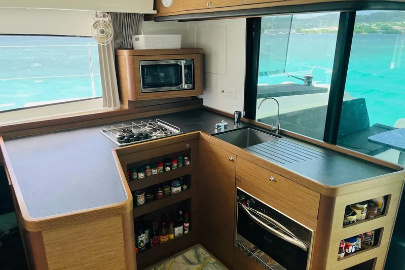 Always Sunday Yacht Photos Pics Modern kitchen interior on 2020 Lagoon 42 yacht with ocean view.