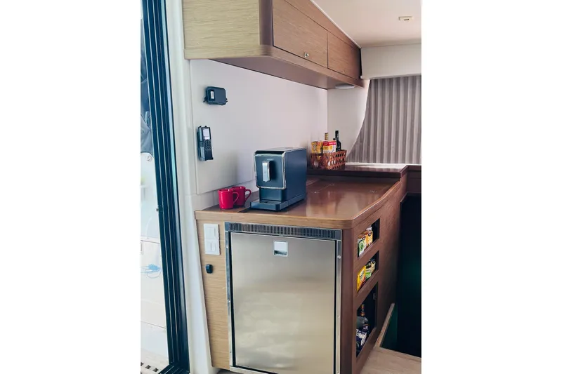 Always Sunday Yacht Photos Pics Modern kitchen area in a 2020 Lagoon 42 yacht with appliances and storage.