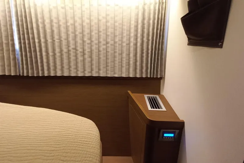 Always Sunday Yacht Photos Pics Interior of 2020 Lagoon 42 yacht cabin with air conditioning unit and curtains.