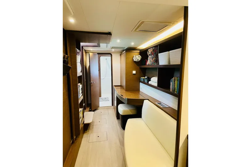 Always Sunday Yacht Photos Pics Interior of 2020 Lagoon 42 yacht with modern wood finish and cozy seating area.