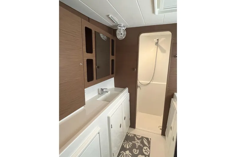 Always Sunday Yacht Photos Pics Modern bathroom interior of 2020 Lagoon 42 yacht with shower and sink.