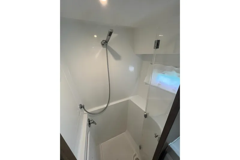 Always Sunday Yacht Photos Pics Modern shower area in 2020 Lagoon 42 catamaran, featuring sleek design and fixtures.