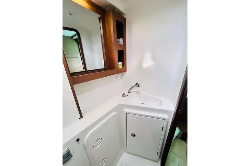 Always Sunday Yacht Photos Pics Modern bathroom interior of 2020 Lagoon 42 yacht with sink and storage.