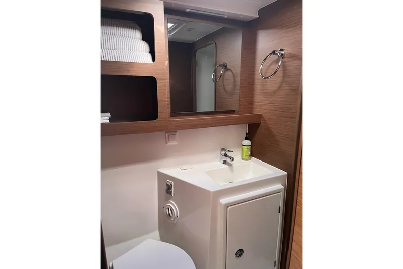 Always Sunday Yacht Photos Pics Modern bathroom interior of 2020 Lagoon 42 yacht with sink, mirror, and storage.
