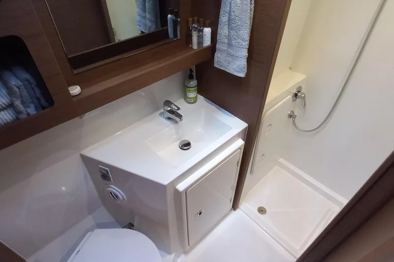 Always Sunday Yacht Photos Pics Bathroom interior of 2020 Lagoon 42 yacht with sink, shower, and storage.