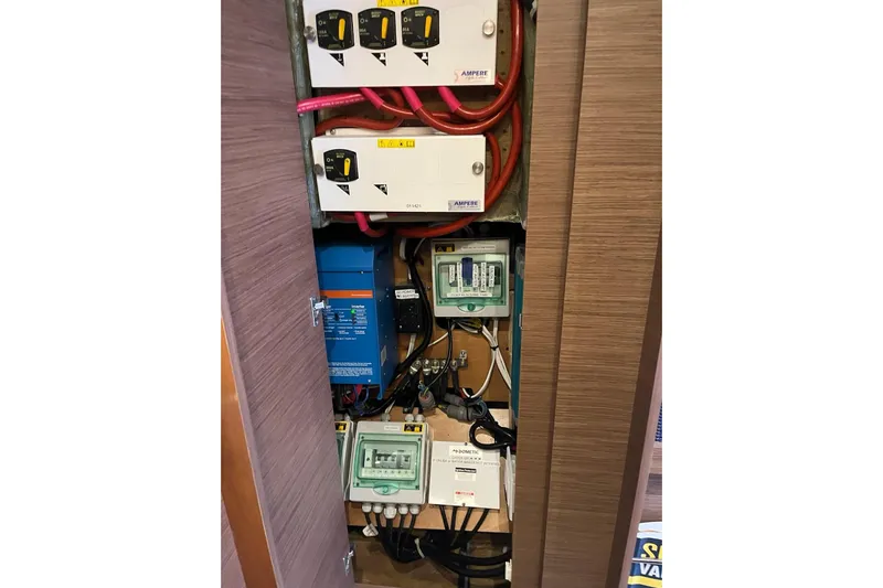 Always Sunday Yacht Photos Pics Electrical panel inside a 2020 Lagoon 42 yacht, featuring various switches and wiring.