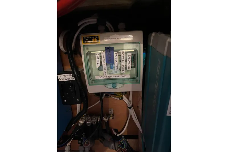 Always Sunday Yacht Photos Pics Electrical panel on a 2020 Lagoon 42 catamaran with labeled switches and wiring.