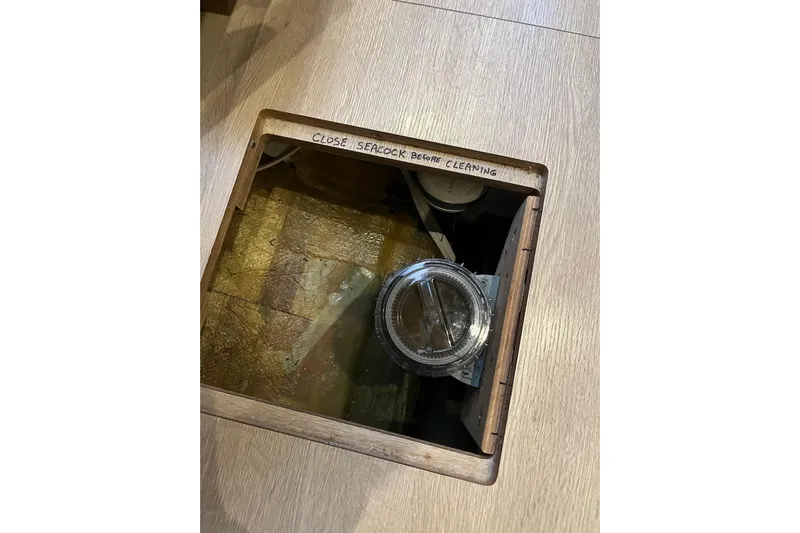 Always Sunday Yacht Photos Pics Inspection hatch on 2020 Lagoon 42 catamaran with seacock warning label.