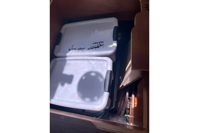 Always Sunday Yacht Photos Pics Storage compartment on Lagoon 42 yacht, 2020 model, with labeled containers.