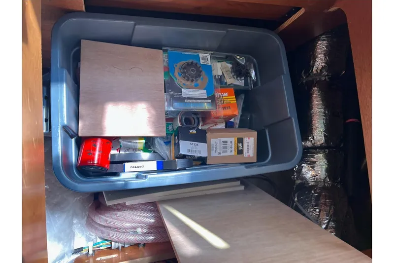 Always Sunday Yacht Photos Pics Storage bin with various tools and supplies inside a 2020 Lagoon 42 yacht.