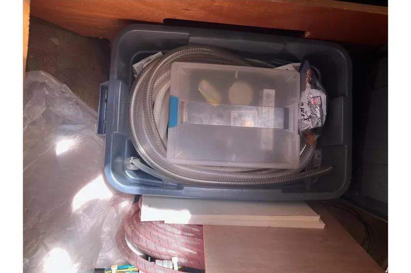 Always Sunday Yacht Photos Pics Storage bin with hoses and tools inside a Lagoon 42, 2020 model.