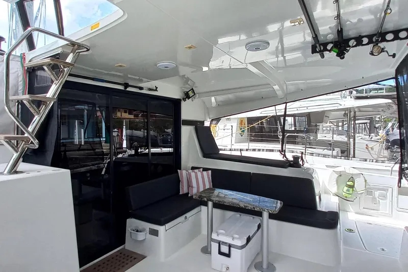 Always Sunday Yacht Photos Pics 2020 Lagoon 42 yacht interior with seating area and table.