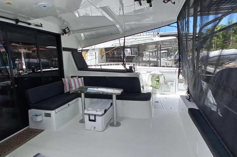 Always Sunday Yacht Photos Pics Spacious deck of 2020 Lagoon 42 catamaran with seating and table.