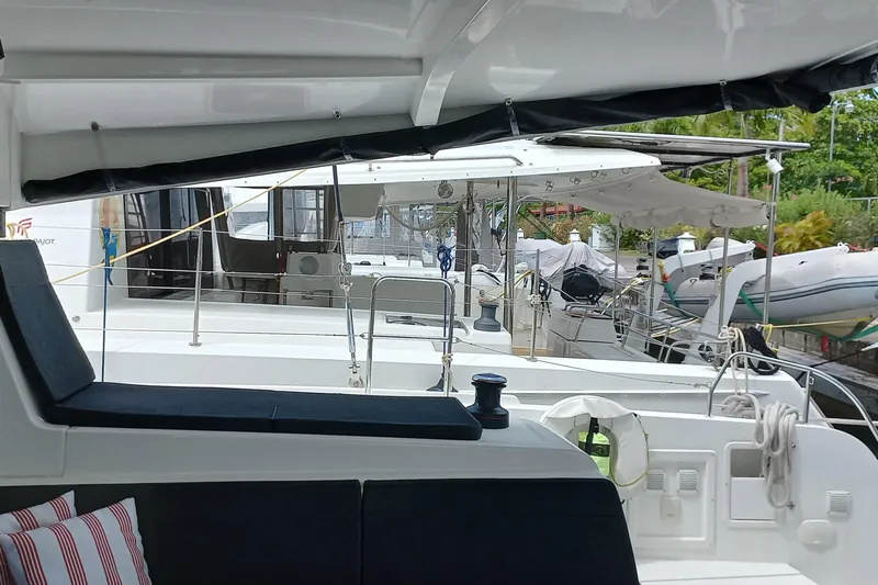 Always Sunday Yacht Photos Pics 2020 Lagoon 42 catamaran docked, featuring spacious deck and modern design.