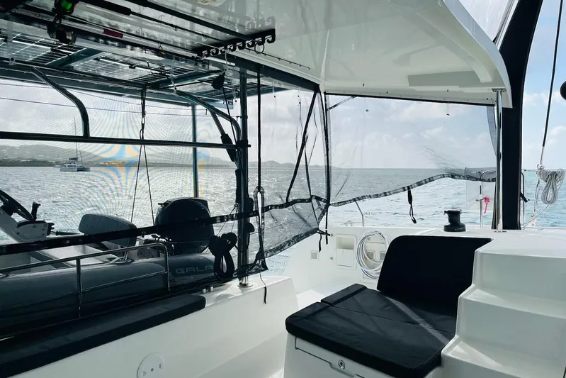 Always Sunday Yacht Photos Pics Interior view of a 2020 Lagoon 42 catamaran with ocean backdrop.