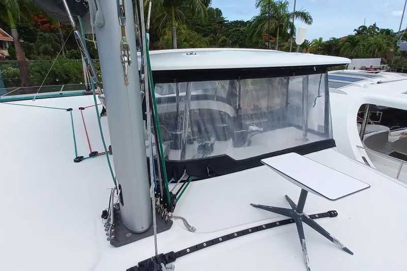 Always Sunday Yacht Photos Pics 2020 Lagoon 42 catamaran deck with mast, ropes, and outdoor seating area.