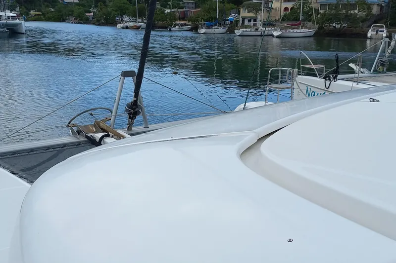 Always Sunday Yacht Photos Pics 2020 Lagoon 42 catamaran docked in a serene marina setting.