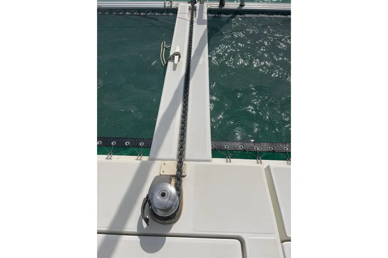 Always Sunday Yacht Photos Pics Deck view of 2020 Lagoon 42 catamaran with anchor chain and netting.