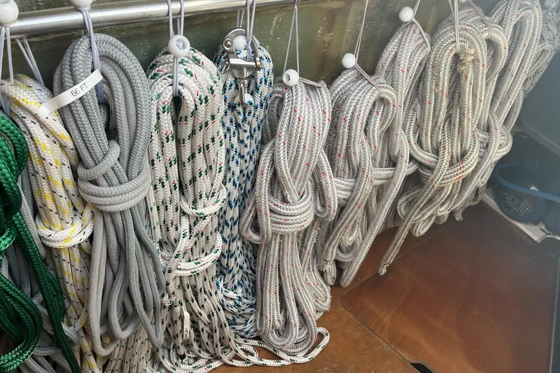 Always Sunday Yacht Photos Pics Coiled ropes on a 2020 Lagoon 42 catamaran, neatly organized and labeled.