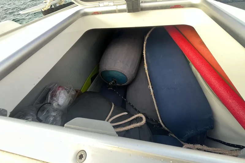 Always Sunday Yacht Photos Pics Storage compartment on a 2020 Lagoon 42 boat with fenders and equipment.