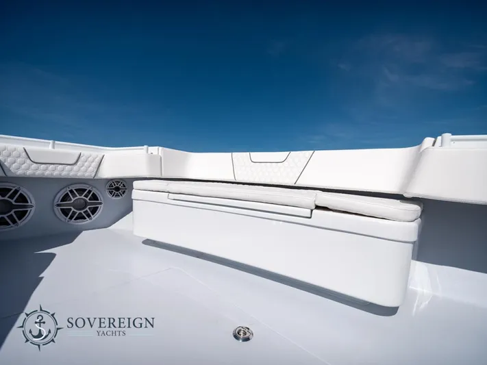 44-023 Yacht Photos Pics Contender 44 CB 2024 boat interior with white seating and speakers, Sovereign Yachts logo.