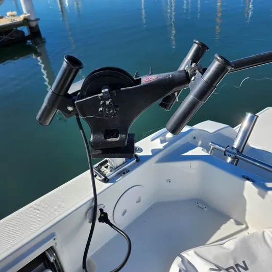 Hanolei Yacht Photos Pics Fishing rod holder on a 2021 Jeanneau 9.0 CC boat, docked by calm waters.