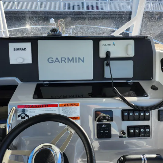 Hanolei Yacht Photos Pics Helm of 2021 Jeanneau 9.0 CC with Garmin and Simrad navigation systems.