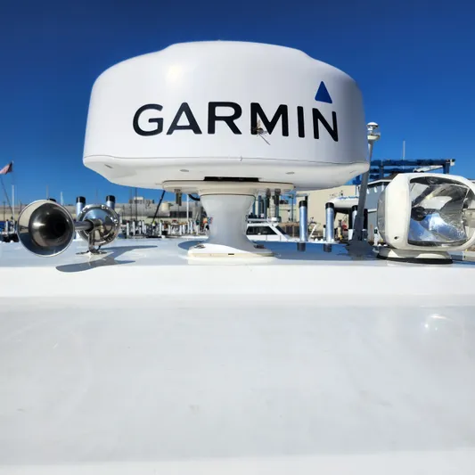 Hanolei Yacht Photos Pics Garmin radar on 2021 Jeanneau 9.0 CC boat, clear blue sky background.