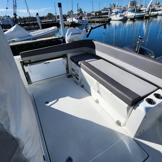 Hanolei Yacht Photos Pics 2021 Jeanneau 9.0 CC boat interior with seating, docked at marina.