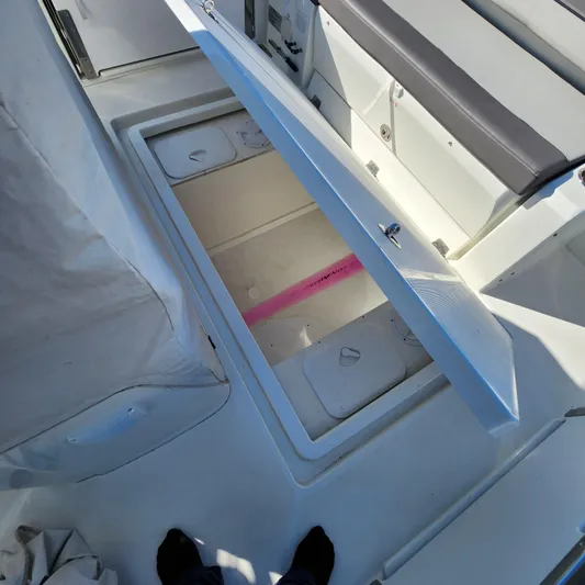 Hanolei Yacht Photos Pics Open storage compartment on a 2021 Jeanneau 9.0 CC boat deck.