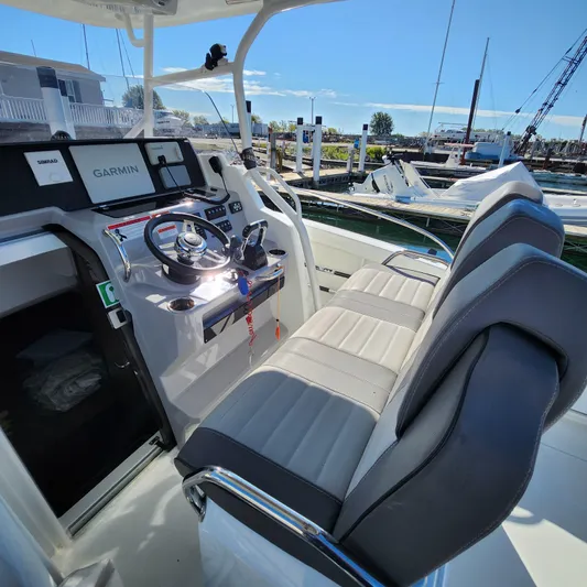 Hanolei Yacht Photos Pics 2021 Jeanneau 9.0 CC boat cockpit with Garmin navigation system and comfortable seating.