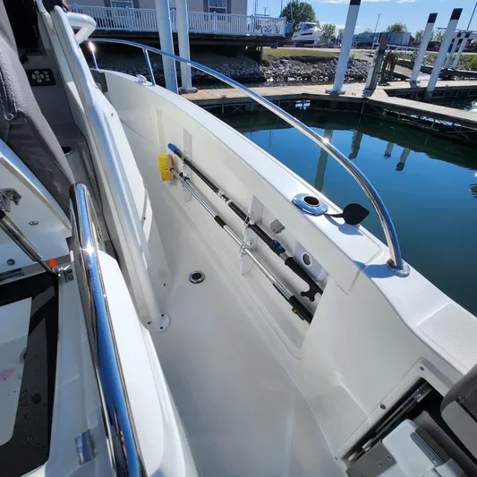 Hanolei Yacht Photos Pics 2021 Jeanneau 9.0 CC boat deck with storage and railing, docked at marina.