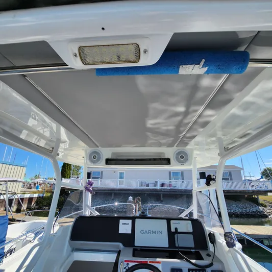 Hanolei Yacht Photos Pics 2021 Jeanneau 9.0 CC boat cockpit with Garmin navigation system and overhead speakers.