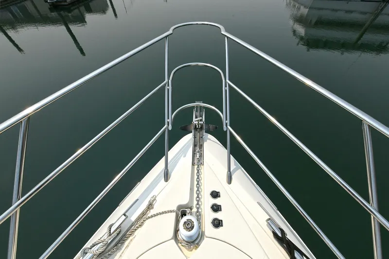  Yacht Photos Pics Bow view of 2003 Azimut 62 yacht with stainless steel railings and anchor chain.