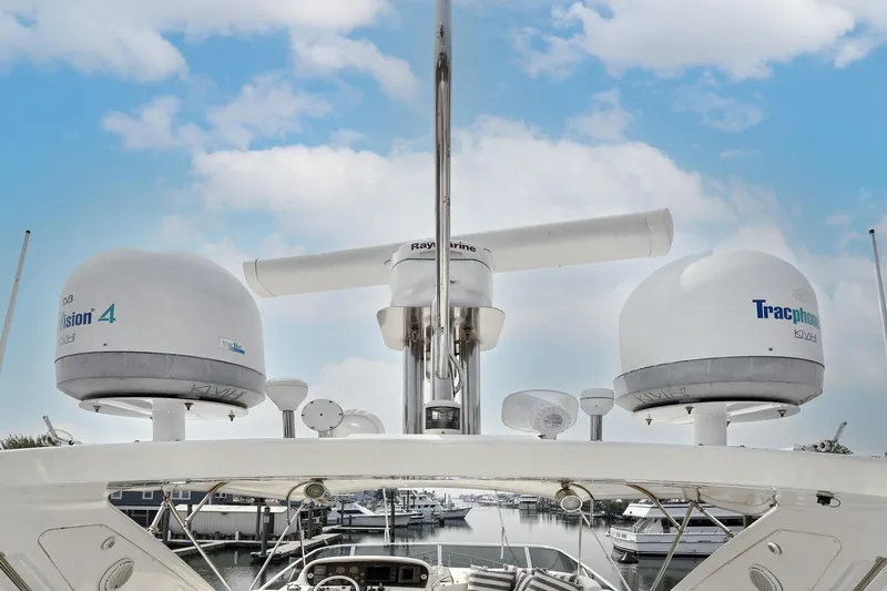  Yacht Photos Pics 2003 Azimut 62 yacht radar and satellite equipment against a cloudy sky.