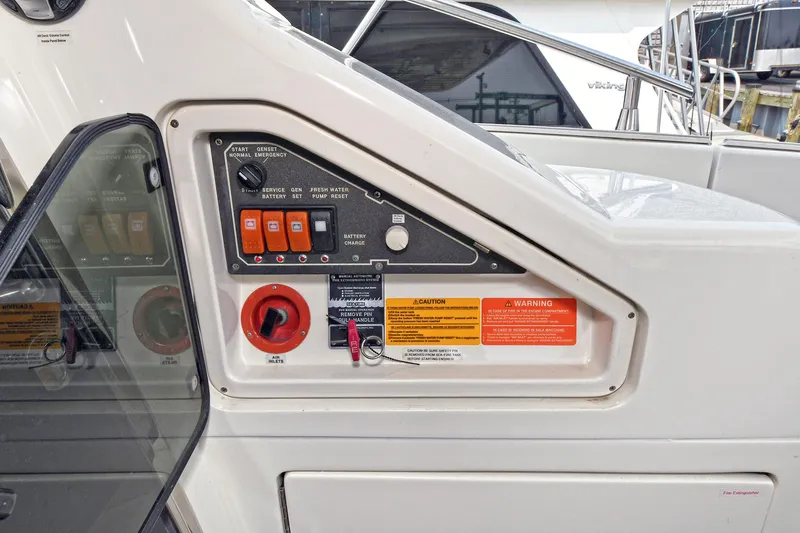  Yacht Photos Pics Control panel of a 2003 Azimut 62 yacht with switches and safety warnings.