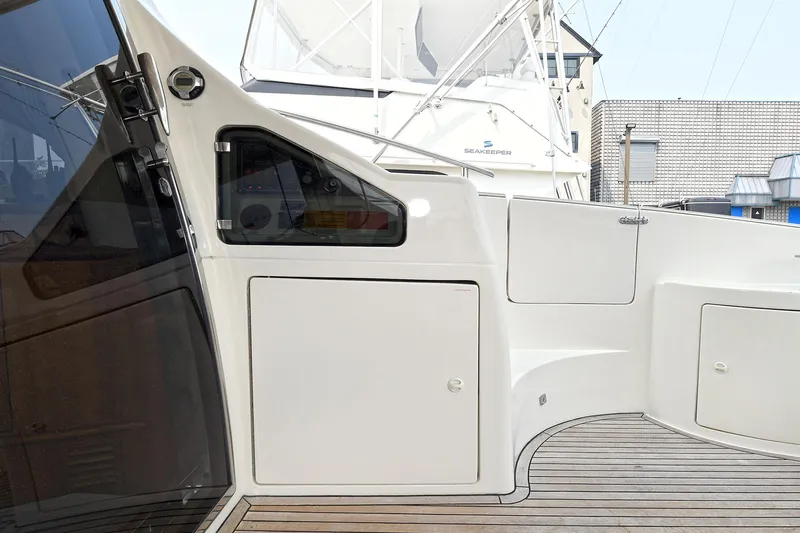  Yacht Photos Pics 2003 Azimut 62 yacht deck with sleek design and wooden flooring.