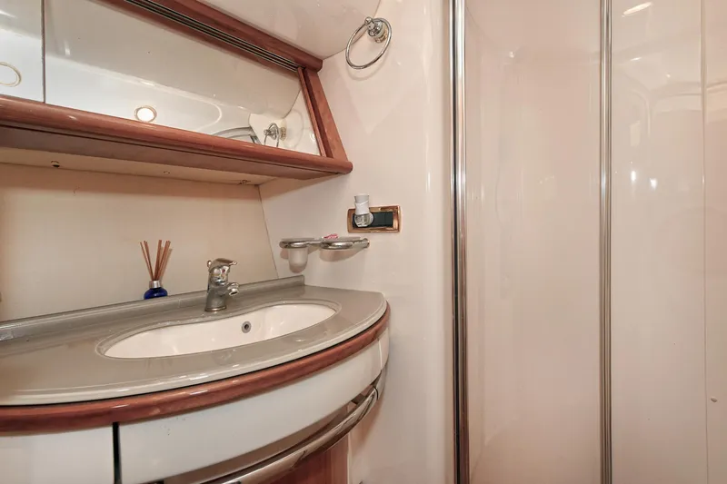  Yacht Photos Pics Luxurious bathroom in a 2003 Azimut 62 yacht with modern fixtures and elegant design.