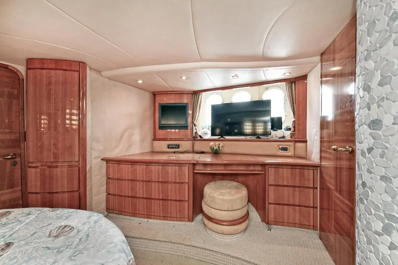  Yacht Photos Pics Luxurious interior of a 2003 Azimut 62 yacht with elegant wood cabinetry and modern amenities.