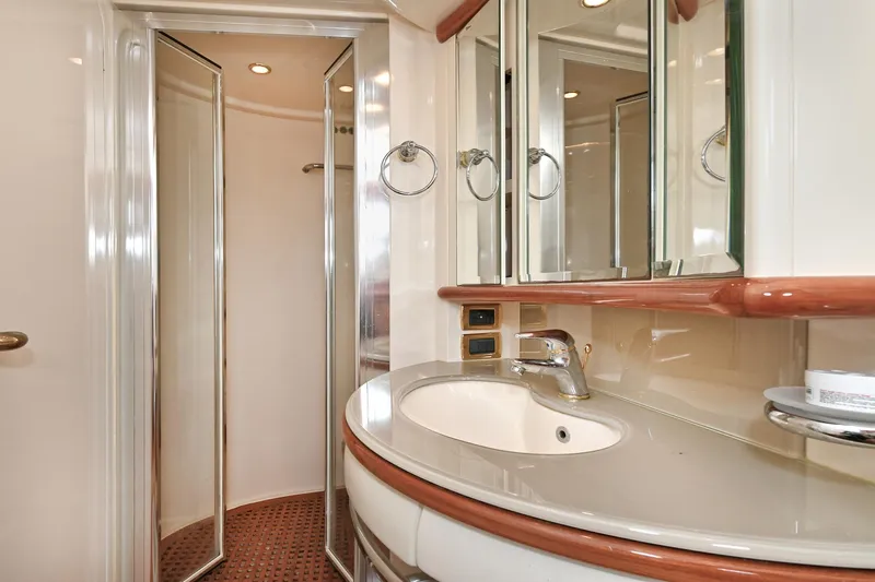  Yacht Photos Pics Luxurious bathroom interior of 2003 Azimut 62 yacht with modern fixtures and elegant design.