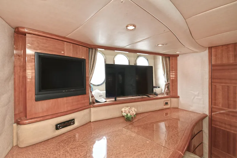  Yacht Photos Pics Luxurious interior of a 2003 Azimut 62 yacht with elegant wood finishes and modern amenities.