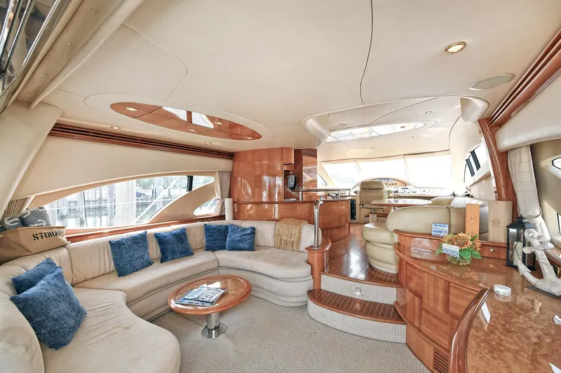  Yacht Photos Pics Luxurious interior of a 2003 Azimut 62 yacht with elegant seating and wooden finishes.
