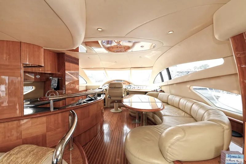  Yacht Photos Pics Luxurious interior of a 2003 Azimut 62 yacht with elegant wood and leather finishes.