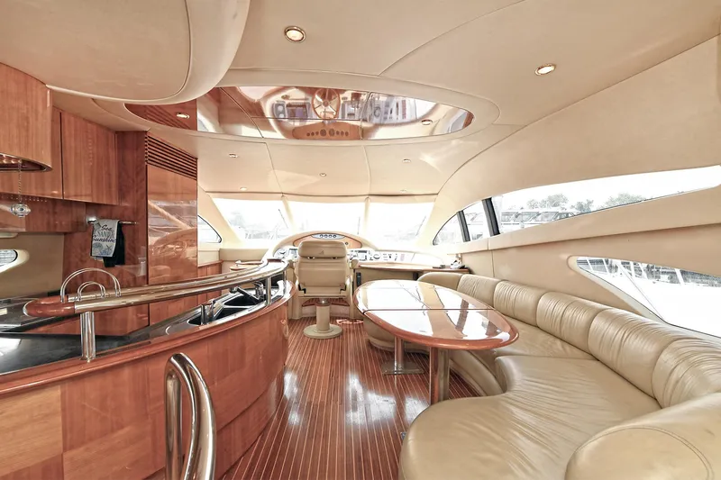  Yacht Photos Pics Luxurious interior of a 2003 Azimut 62 yacht with elegant wood and leather finishes.