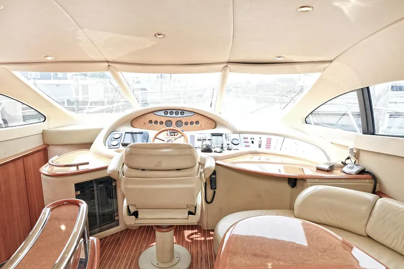  Yacht Photos Pics Luxurious interior of a 2003 Azimut 62 yacht with elegant helm and seating area.