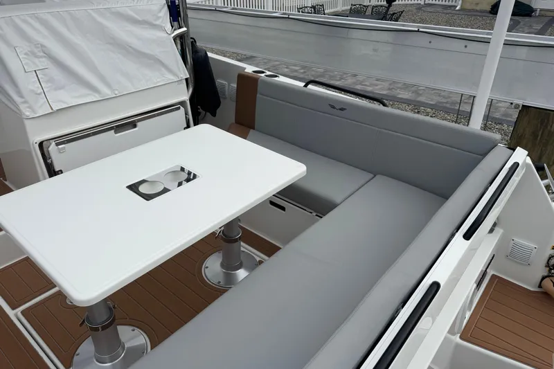  Yacht Photos Pics 2024 Beneteau Flyer 9 SUNdeck interior with sleek seating and modern table design.